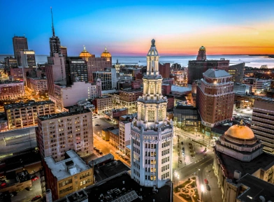 Panoramic twilight aerial view of the downtown Buffalo, New York skyline featured by Rent2Way